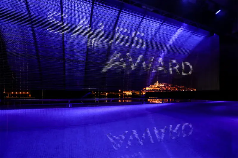 Blue hall with a Sales Award projection